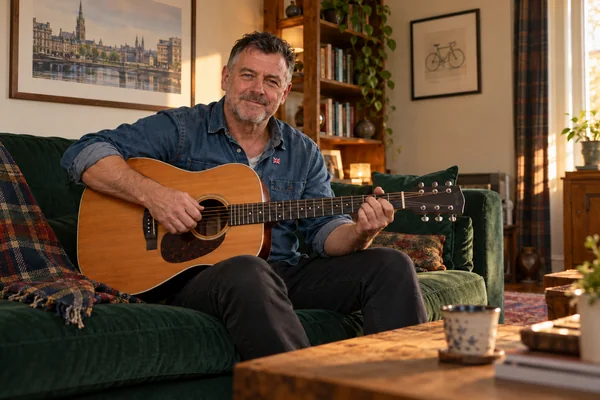 AI-created fictional Thomas Kerr, aged 57, in a personal veterans’ residential room. No real person or institution.