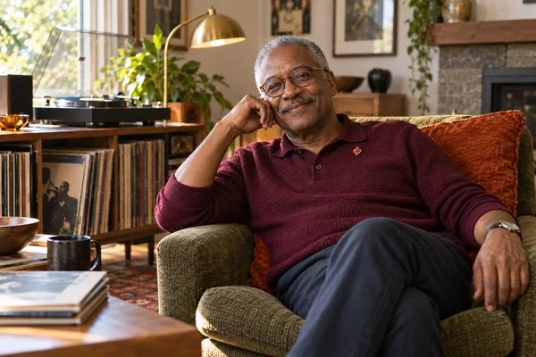 AI-created fictional David Okafor, aged 64, in a personal veterans’ residential room. No real person or institution.